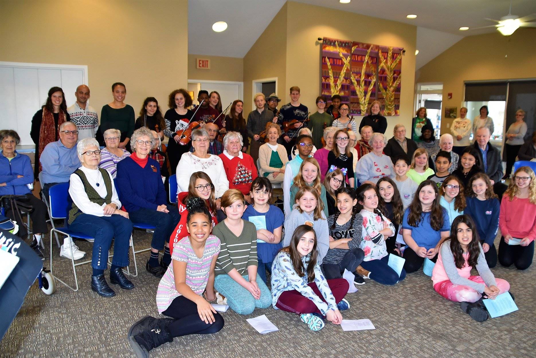 Group of senior center members with high school students