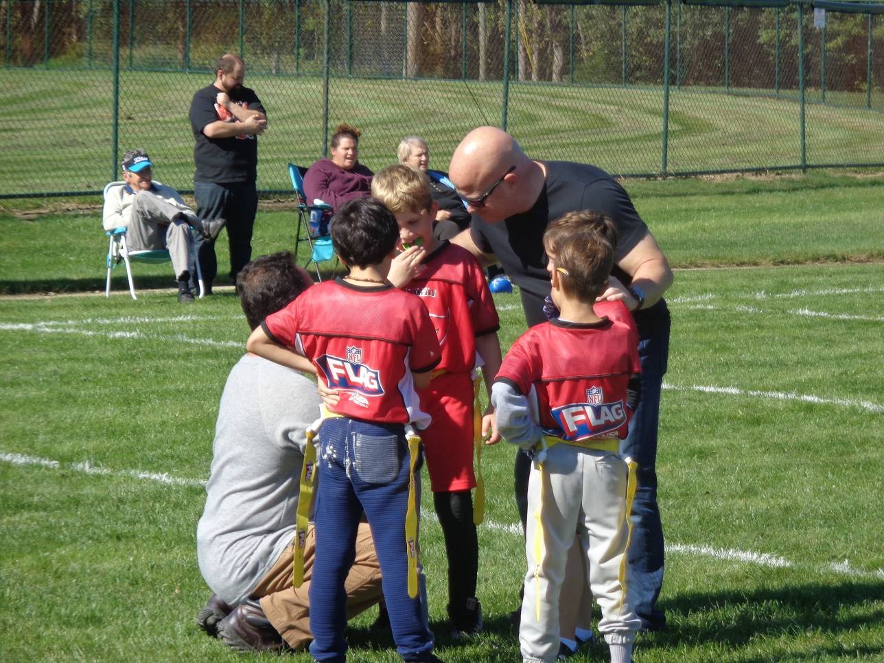 Volunteer coachings flag football players