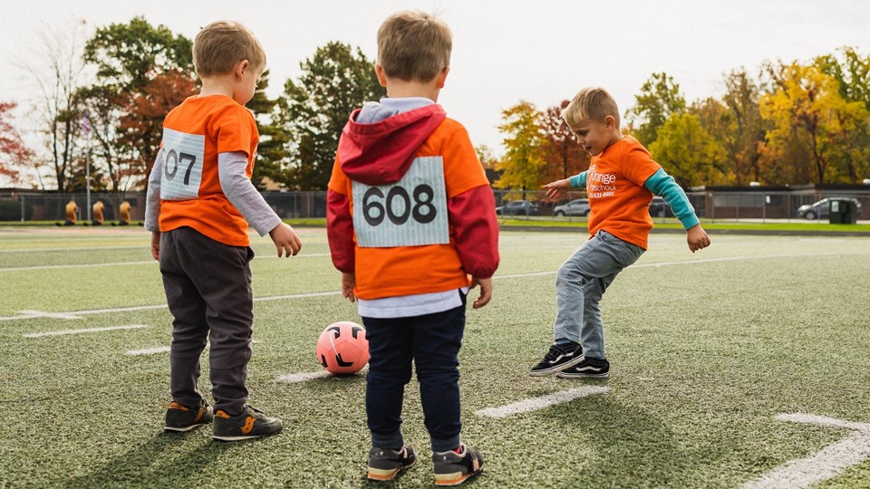 Preschool boys playing soccer